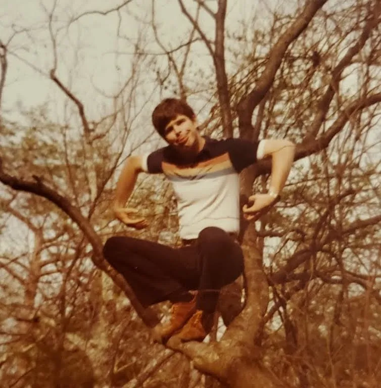Bill climbing a tree at Hwarang Children's Home