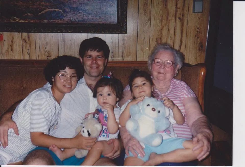 Grandmother Sarah Majors holding baby Sarah, Bill holding Anna, Jakyung beside him